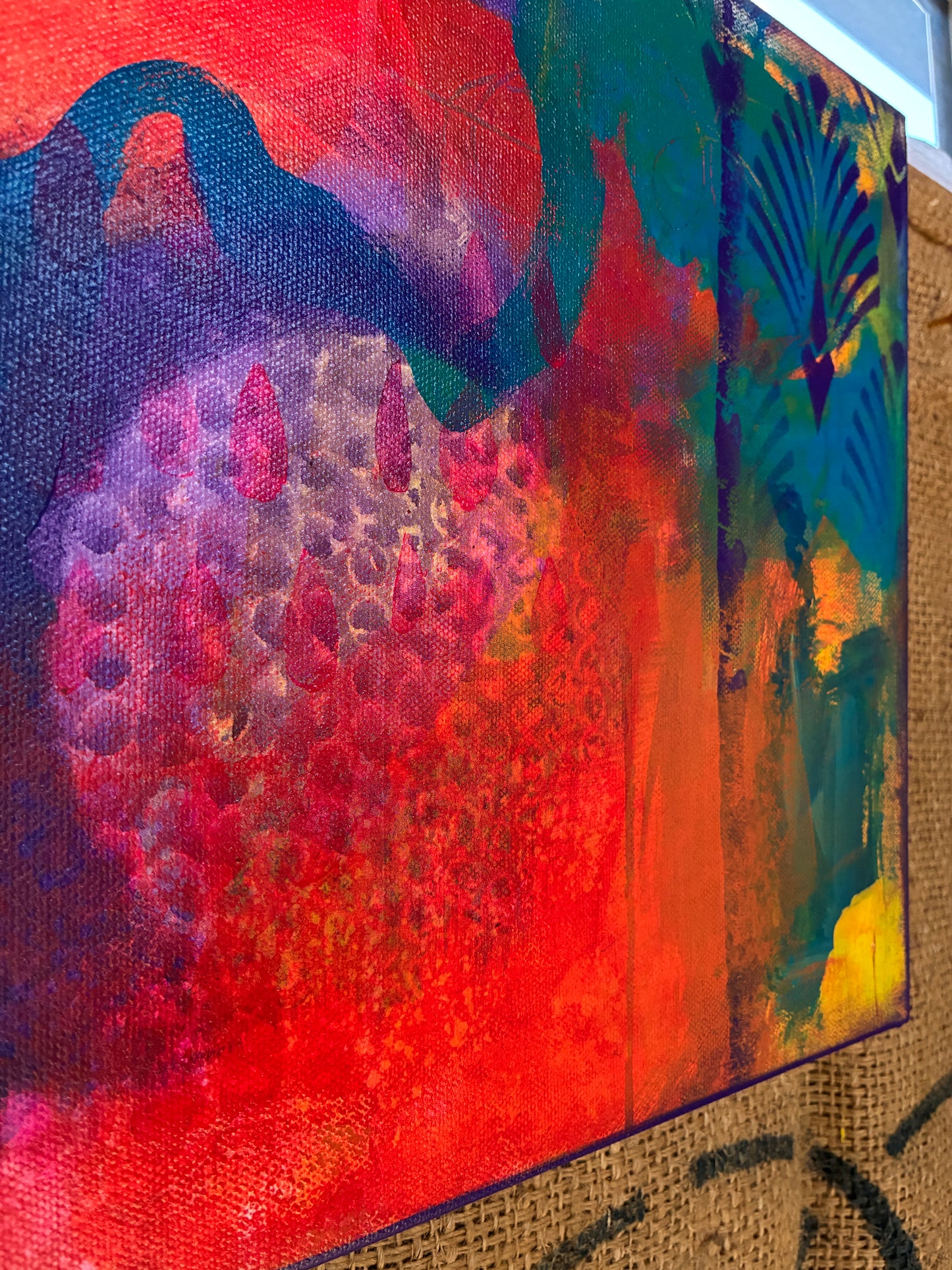 Close-up of ‘Voice’ canvas from Dangerous Duo – dynamic layers and brushwork in pink, blue, and yellow hues.