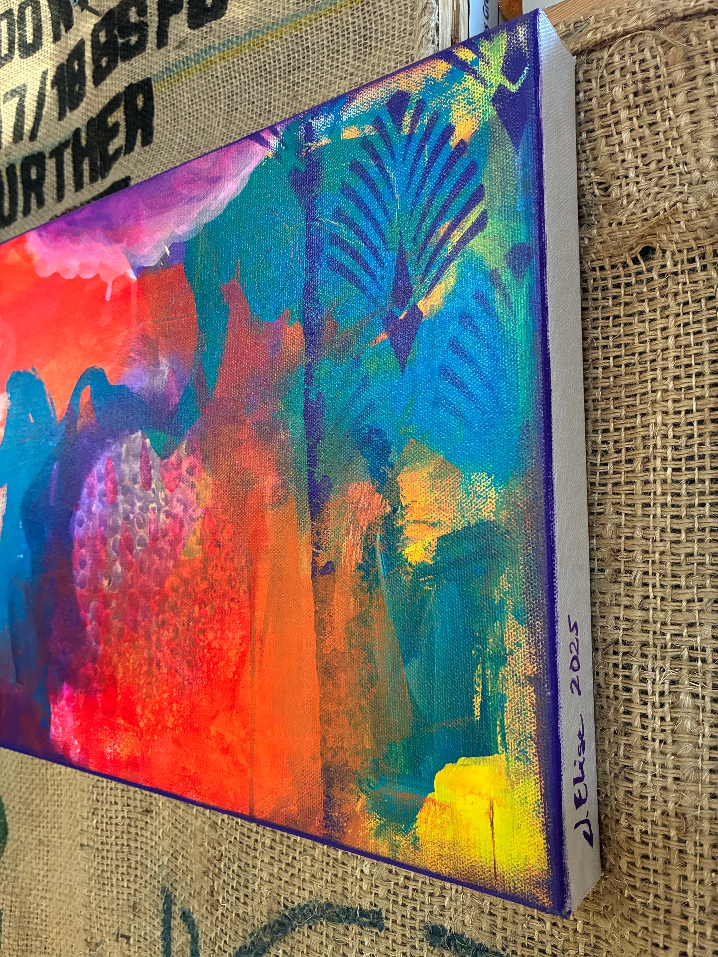 Close-up of ‘Voice’ canvas from Dangerous Duo – dynamic layers and brushwork in pink, blue, and yellow hues.