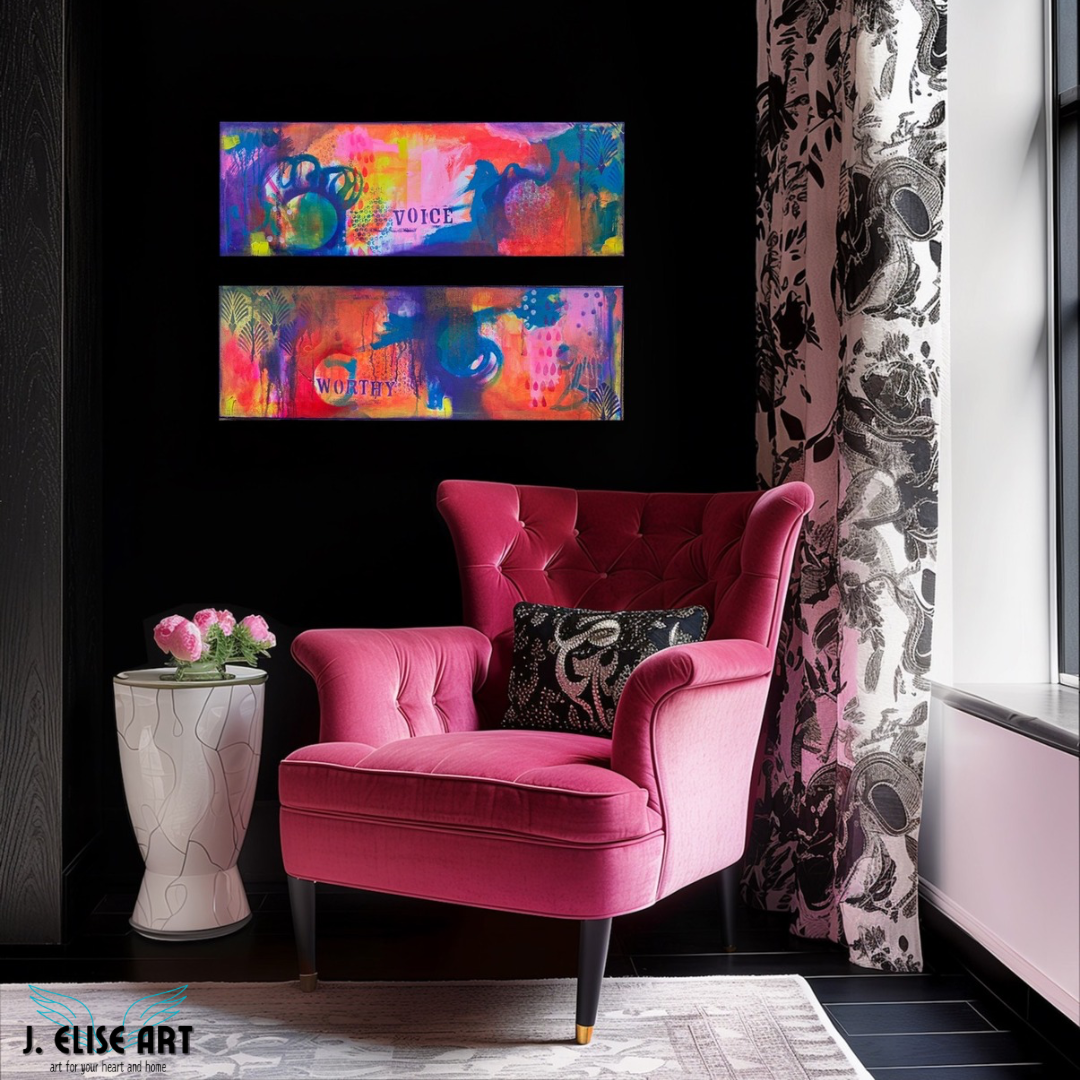 Dangerous Duo diptych by J. Elise Art – abstract painting with the word ‘Worthy’ on one canvas and ‘Voice’ on the other, in vibrant colors of pink, purple, orange, and blue in a moody room with bright pink chair.