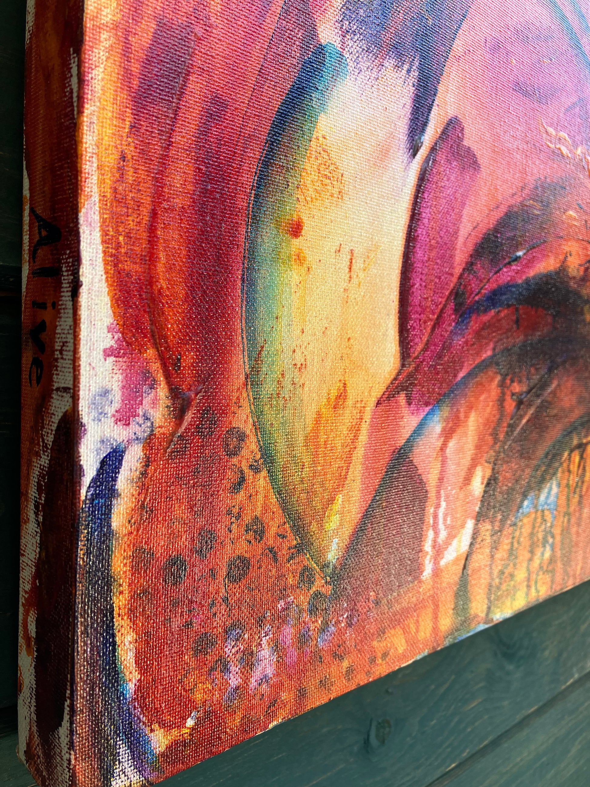 Close up of detail of fiery abstract floral artwork with bold red, orange, and magenta tones, featuring dynamic petal shapes and expressive brushwork that radiates movement and vitality.