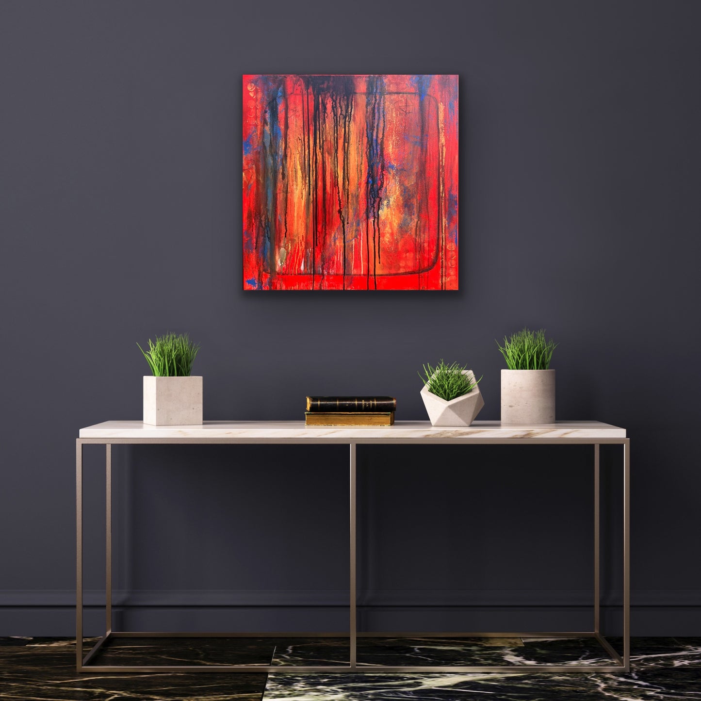 In situ photo of original abstract acrylic painting titled Bravest in a modern room, hanging on a dark moody wall. Bold vertical drips of black, blue, and deep orange cascade over a fiery red and orange background. Rich texture and layered color evoke emotion and resilience.