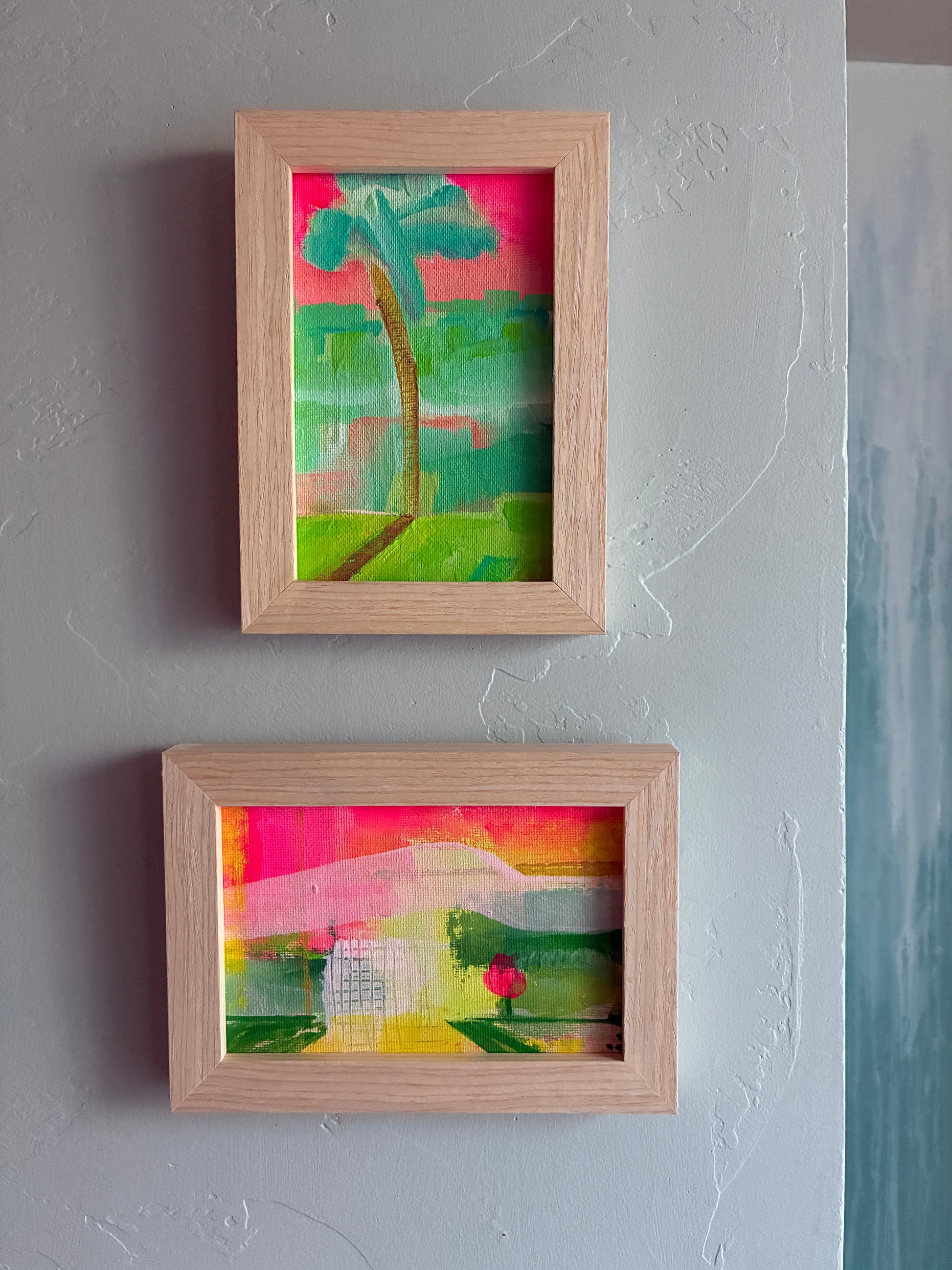 Small framed acrylic painting of a colorful abstract coastal landscape with a single bright pink tree, titled “San Diego Summer II".