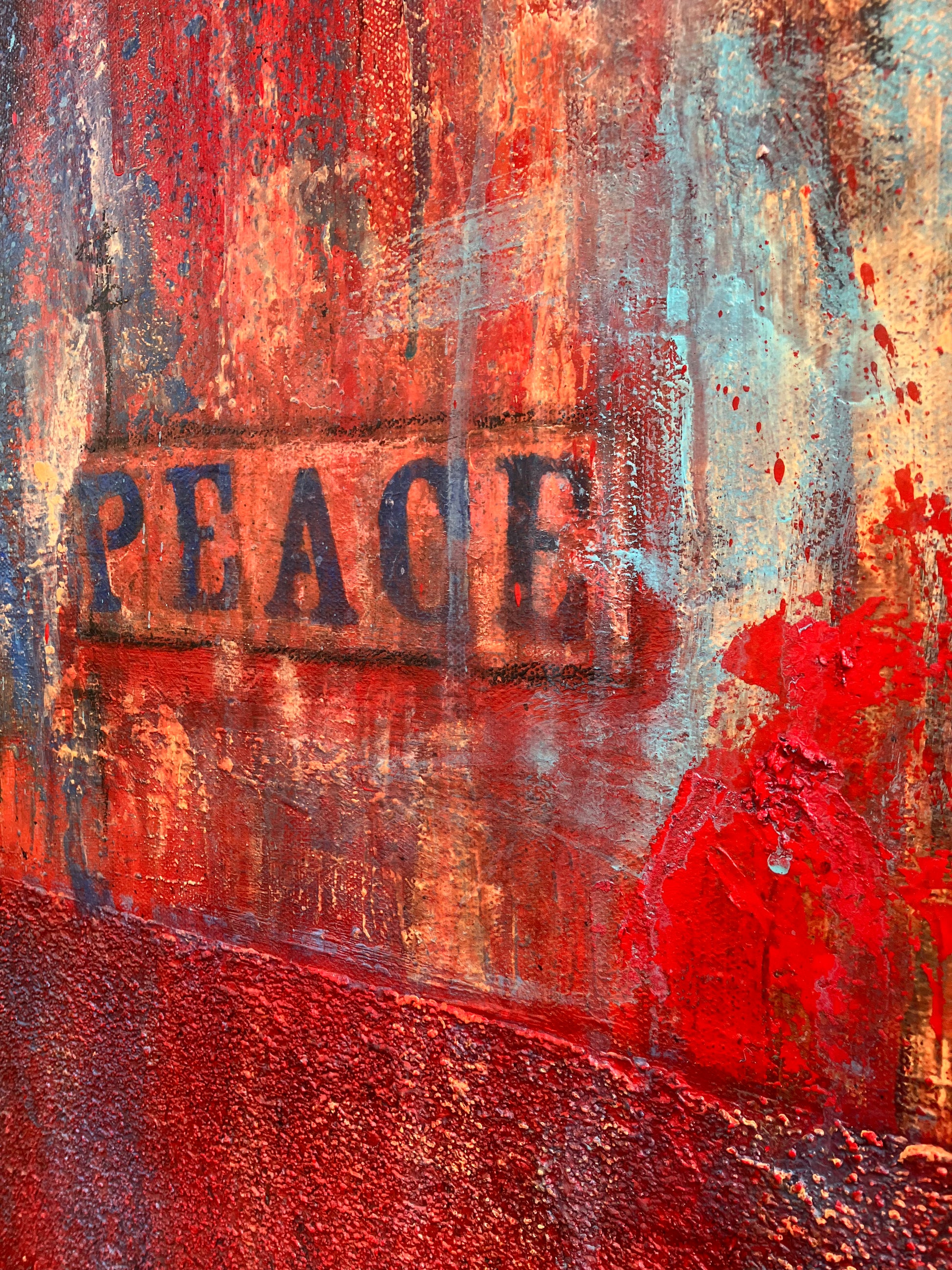 Close up  showing rich texture of original abstract painting titled Surrender, featuring intense vertical drips and swirls of red, blue, and orange with the word “PEACE” subtly stenciled and slightly off-center.